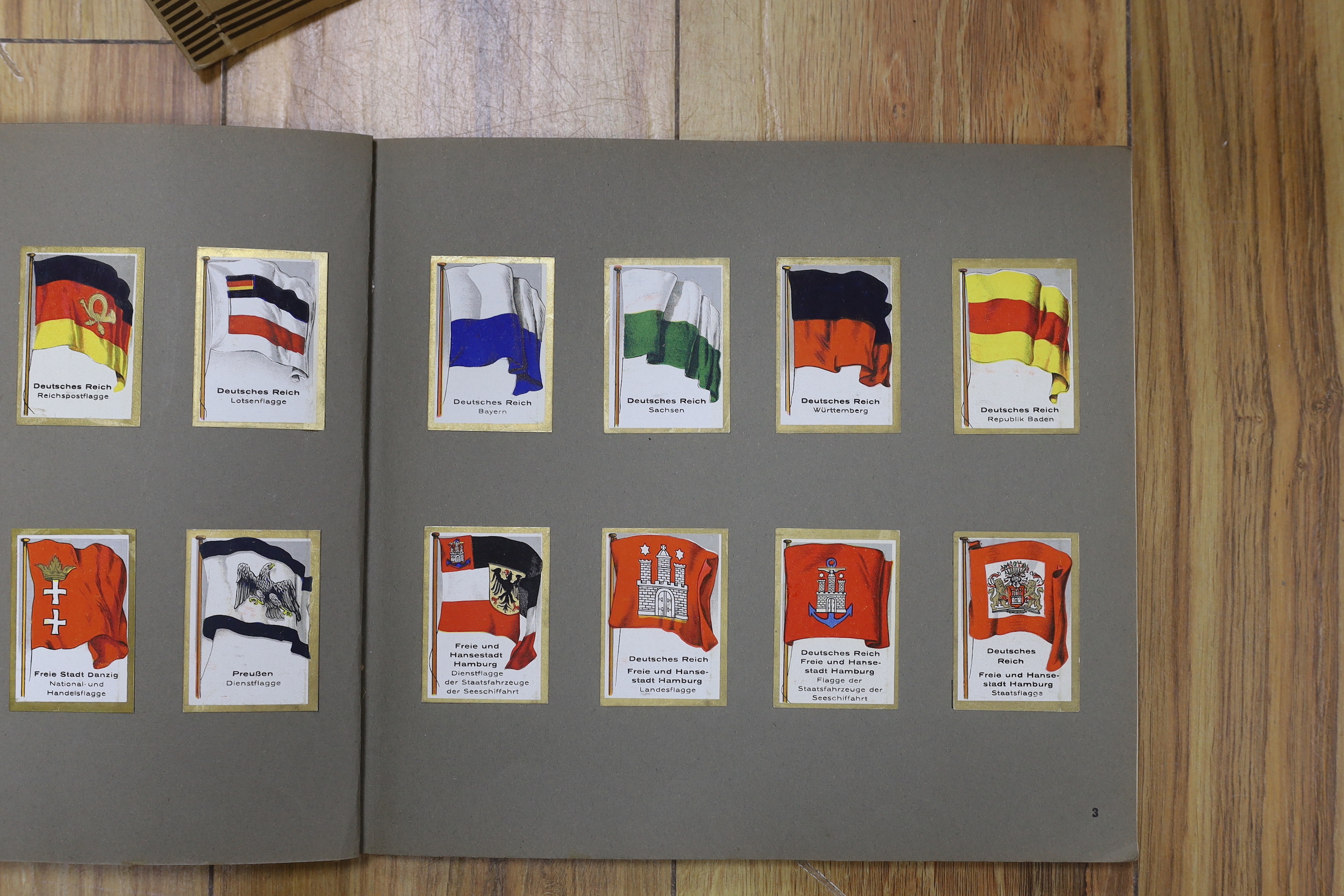 A collection of cigarette cards in albums